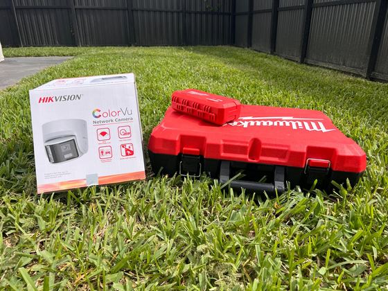 Hikvision ColorVu camera box ready to install next to tools