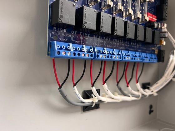 Access control board with neatly dressed red and black wires